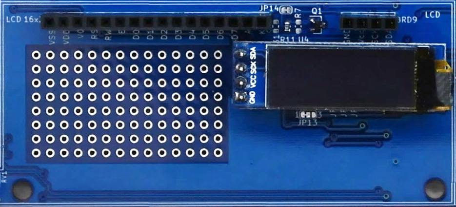 An I2C SSD1306 128x32 OLED display module plugged into BRD10 header of the IoT Proto Shield Plus 